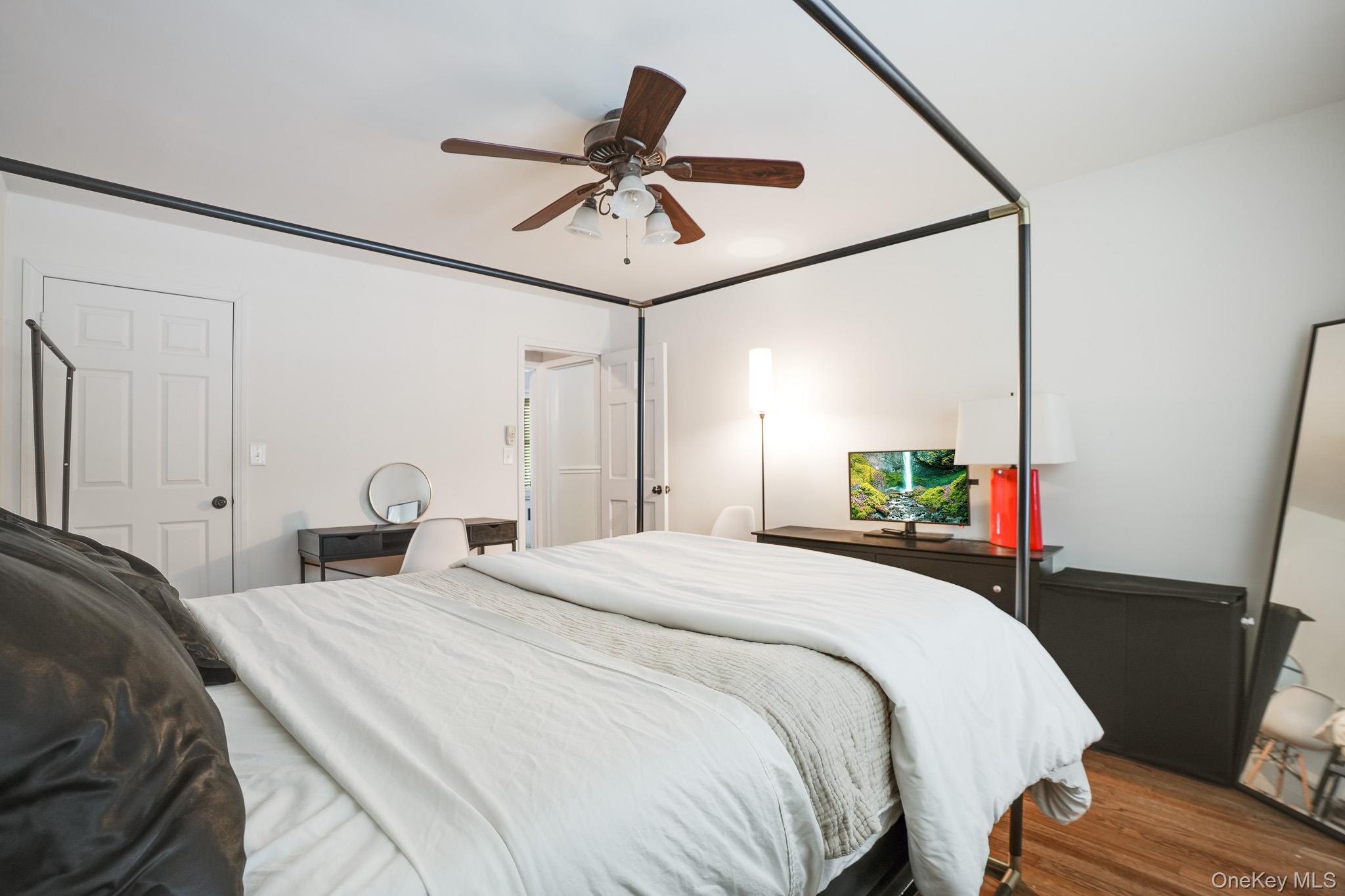 10 Tappan Landing Road, Unit 53A Tarrytown, NY 10591 - Photo 15 of 20 a bedroom with a bed and a chandelier