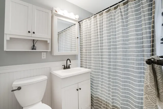 a bedroom with furniture and window