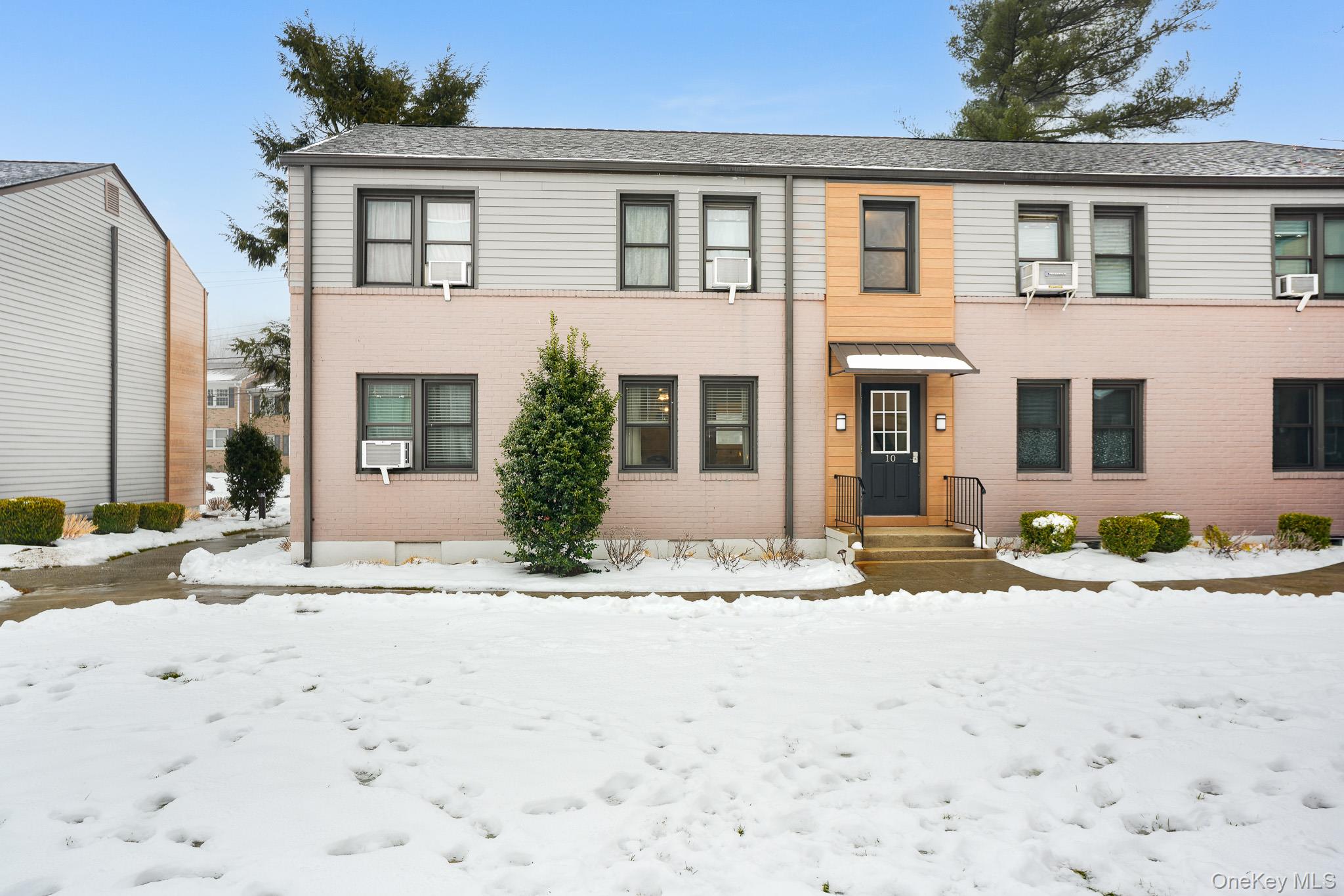 10 Tappan Landing Road, Unit 53A Tarrytown, NY 10591 - Photo 3 of 20 a front view of a house with a yard