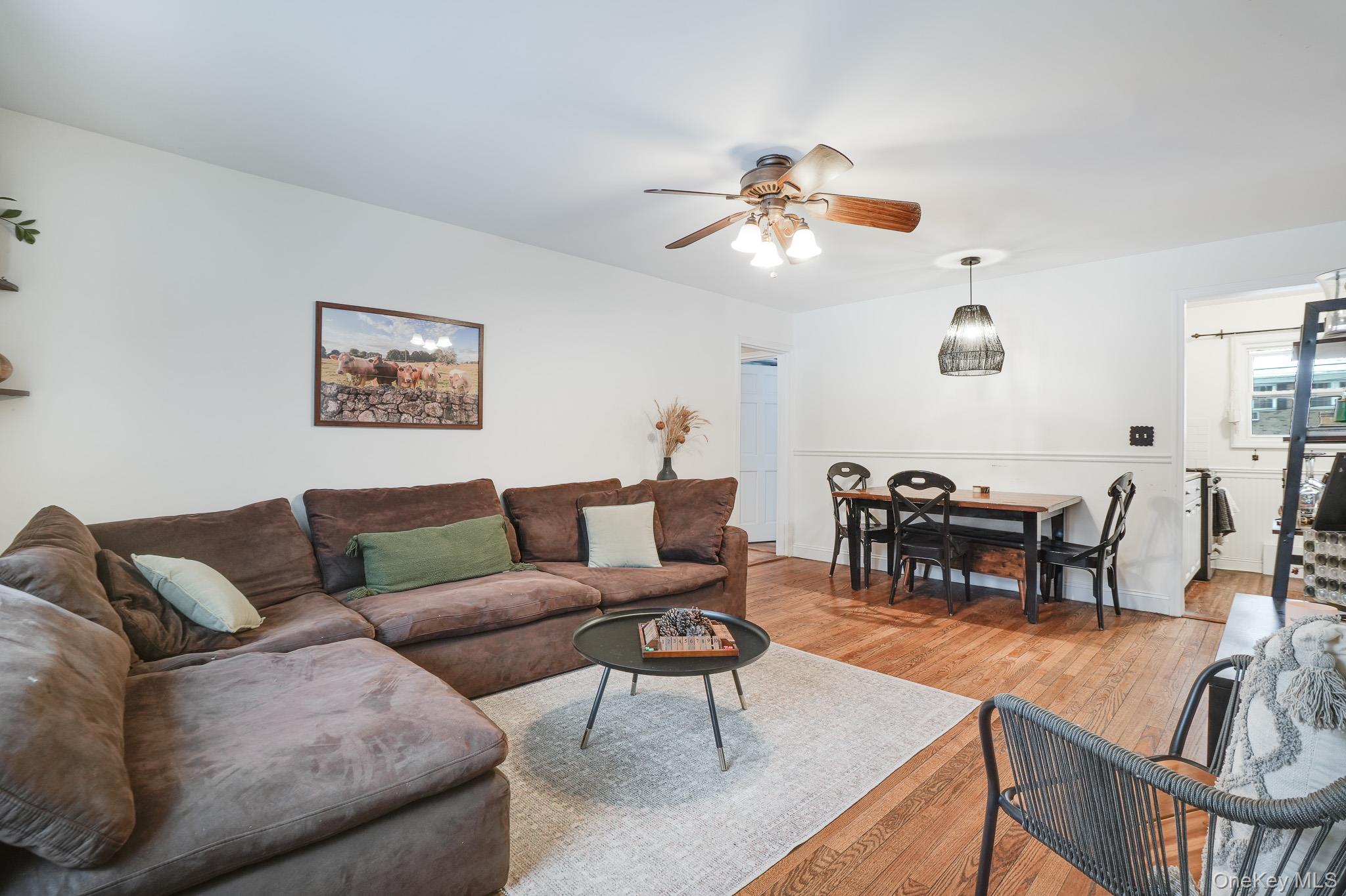 10 Tappan Landing Road, Unit 53A Tarrytown, NY 10591 - Photo 5 of 20 a living room with furniture a dining table and a piano