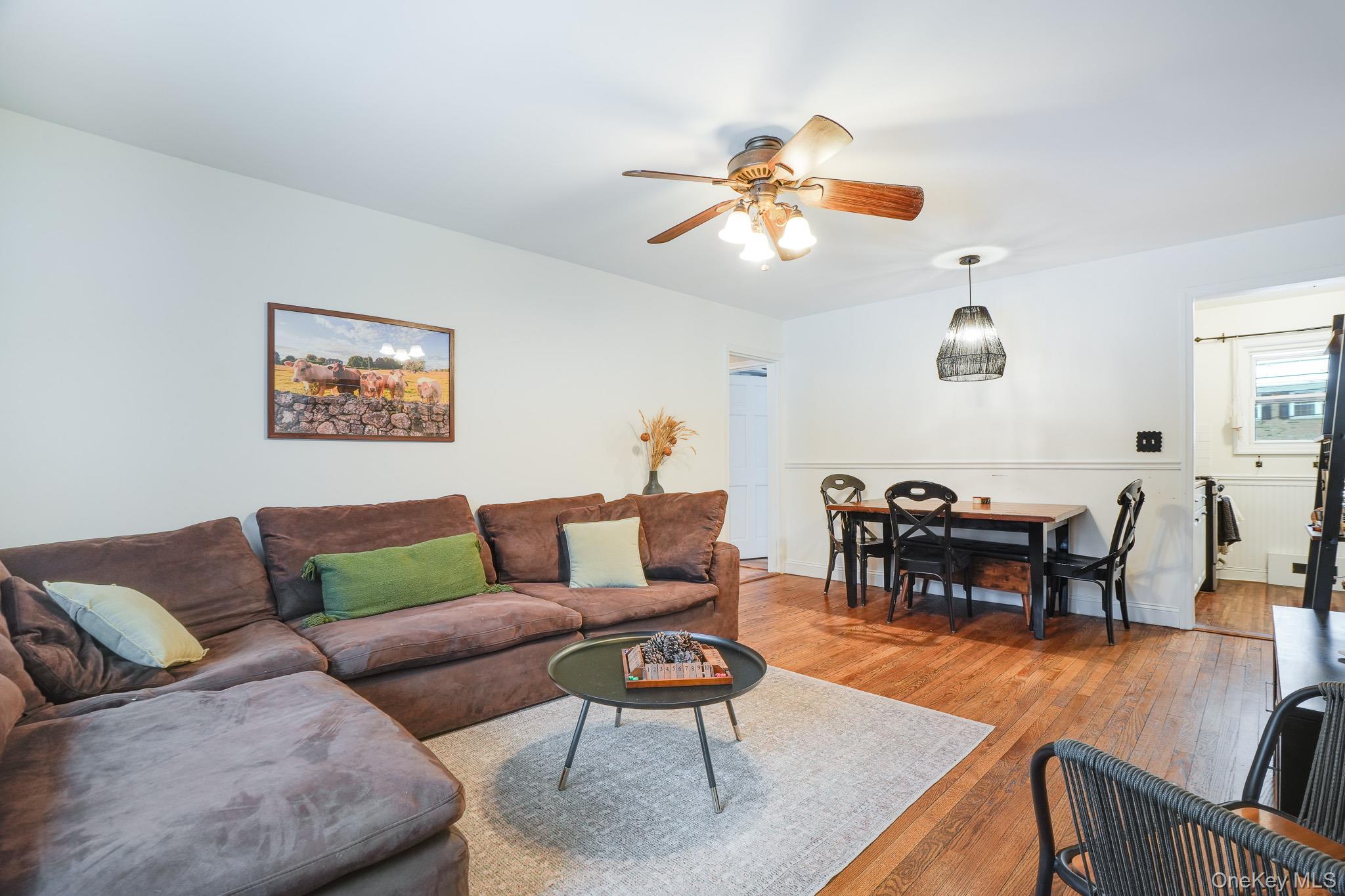 10 Tappan Landing Road, Unit 53A Tarrytown, NY 10591 - Photo 6 of 20 a living room with furniture kitchen view and a dining table