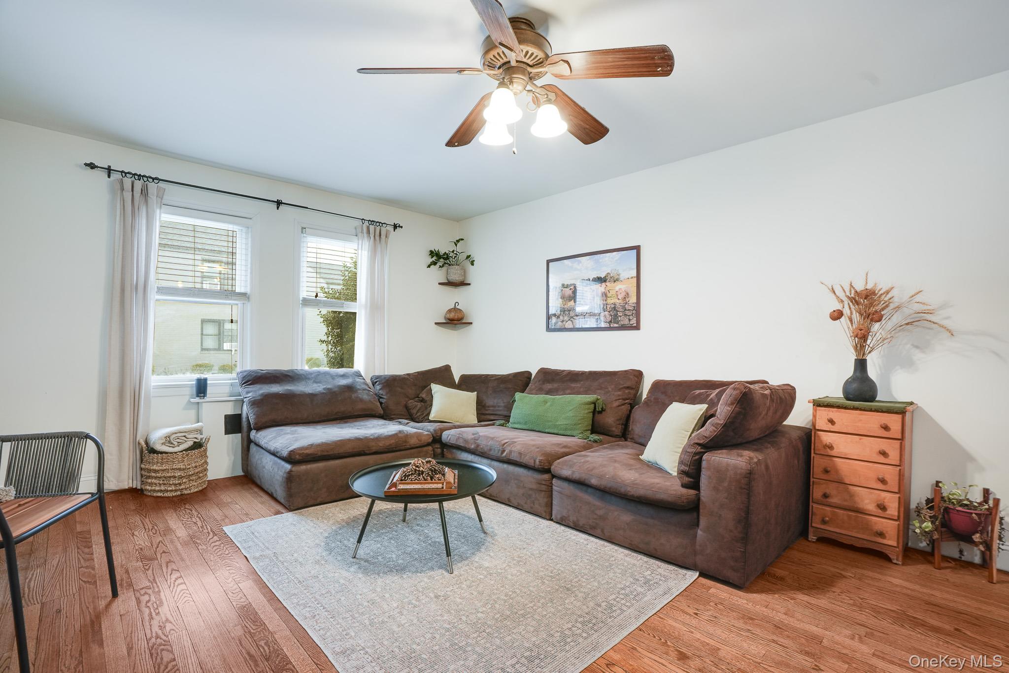 10 Tappan Landing Road, Unit 53A Tarrytown, NY 10591 - Photo 8 of 20 a living room with furniture and a wooden floor