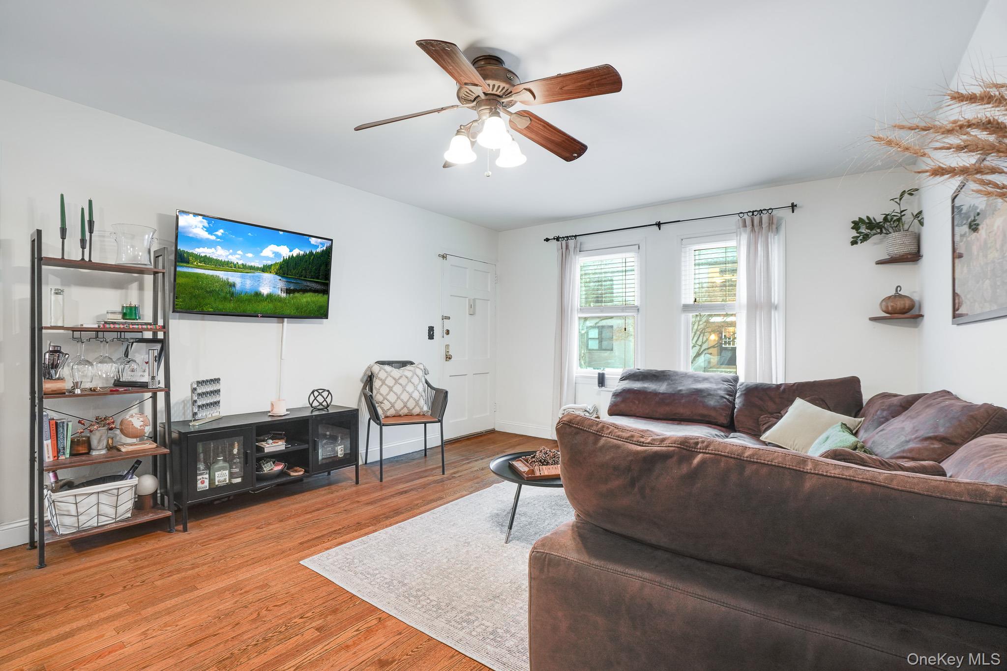 10 Tappan Landing Road, Unit 53A Tarrytown, NY 10591 - Photo 10 of 20 a living room with furniture and a flat screen tv
