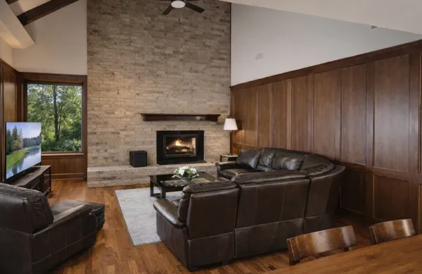 a living room with furniture and a fireplace