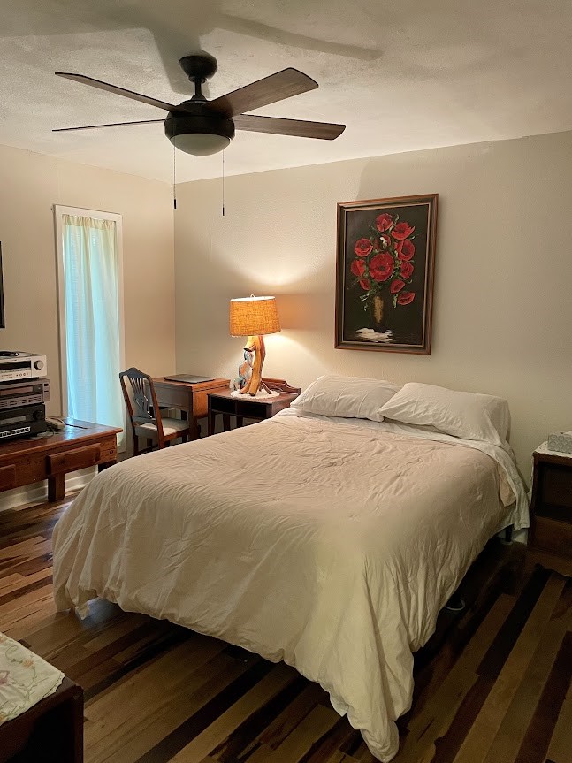 4001 East Carters Ferry Road Milam, TX 75959 - Photo 7 of 22 a bedroom with a bed and a chandelier