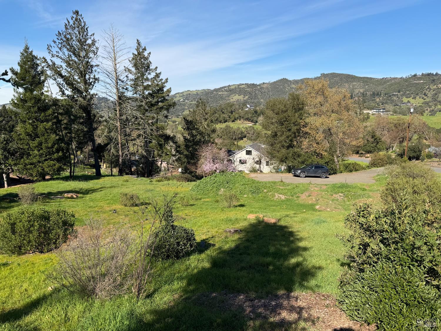 4945 Pinecroft Way Santa Rosa, CA 95404 - Photo 6 of 9 a view of green field with mountains in the background