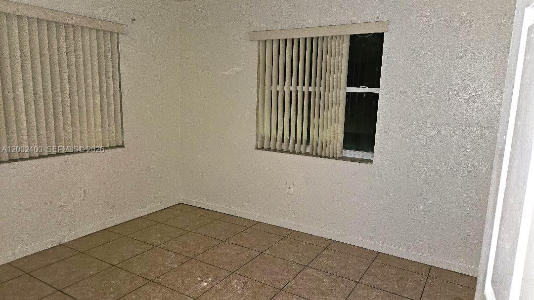 11970 Southwest 217th Street, Unit 11970 Miami, FL 33170 - Photo 8 of 13 a view of a door and a window