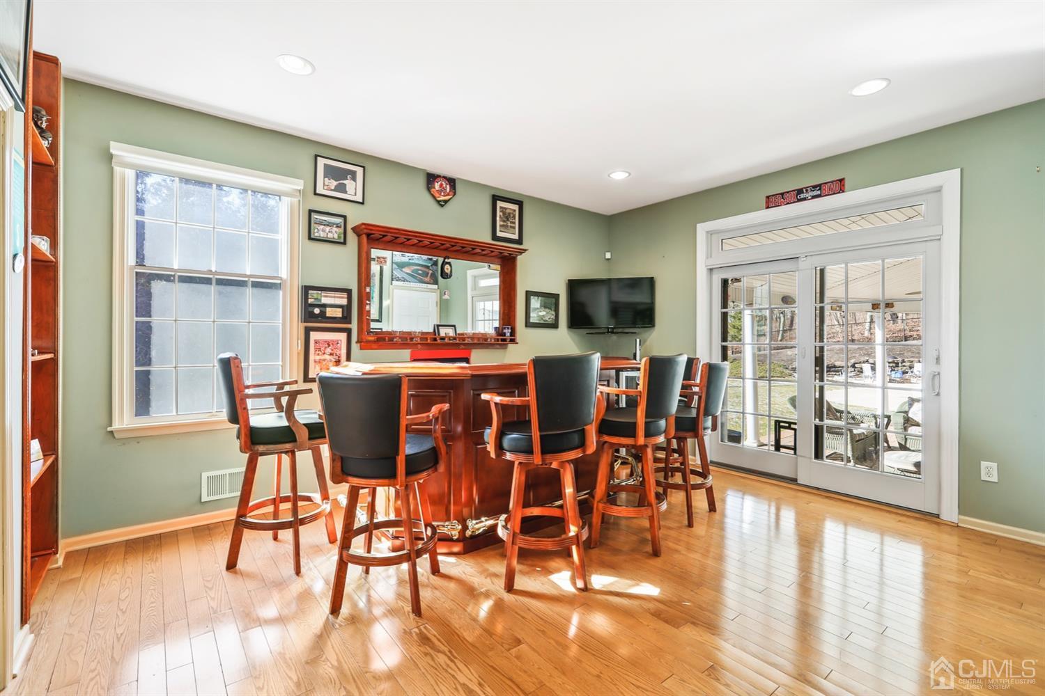 102 Bennett Road Old Bridge, NJ 07747 - Photo 13 of 33 a dining room with furniture floor to ceiling windows and a rug
