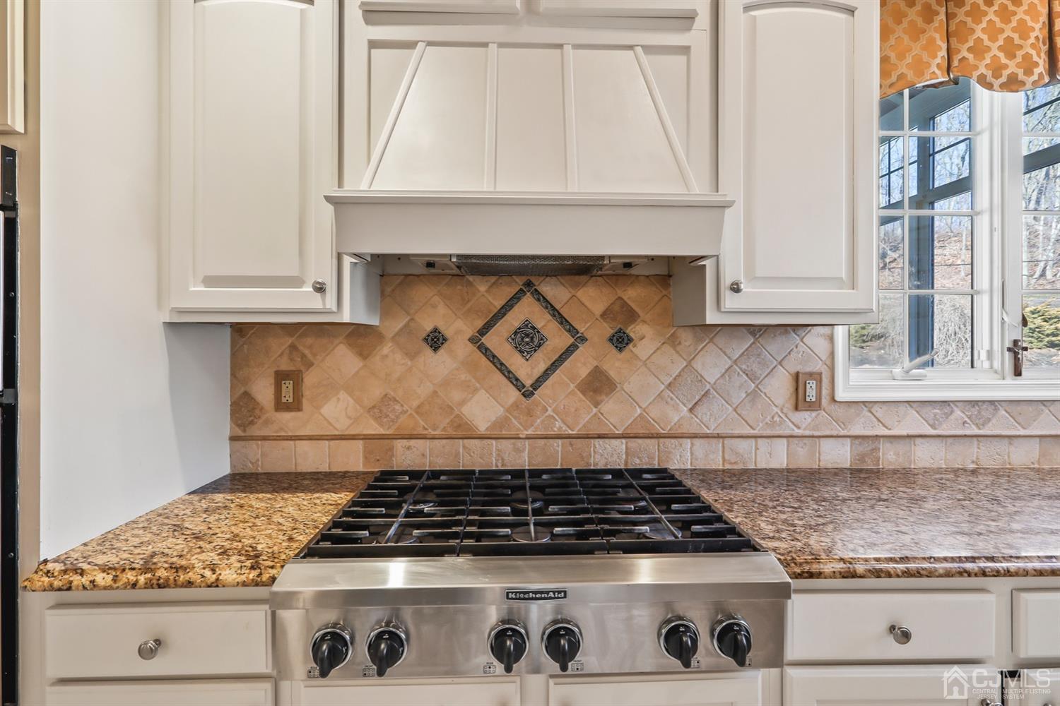 102 Bennett Road Old Bridge, NJ 07747 - Photo 14 of 33 a stove top oven sitting inside of a kitchen