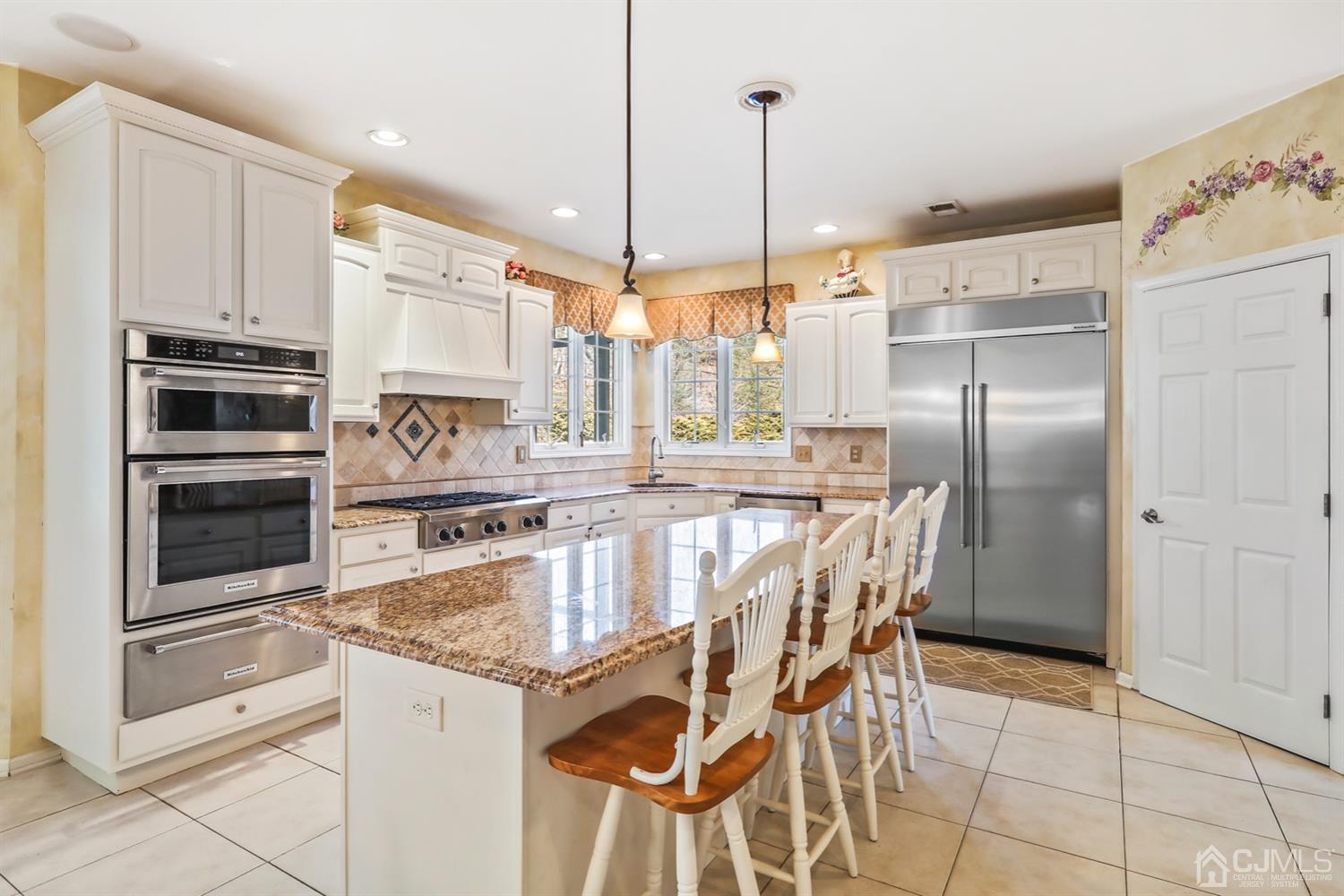 102 Bennett Road Old Bridge, NJ 07747 - Photo 15 of 33 a kitchen with stainless steel appliances granite countertop a stove and a refrigerator