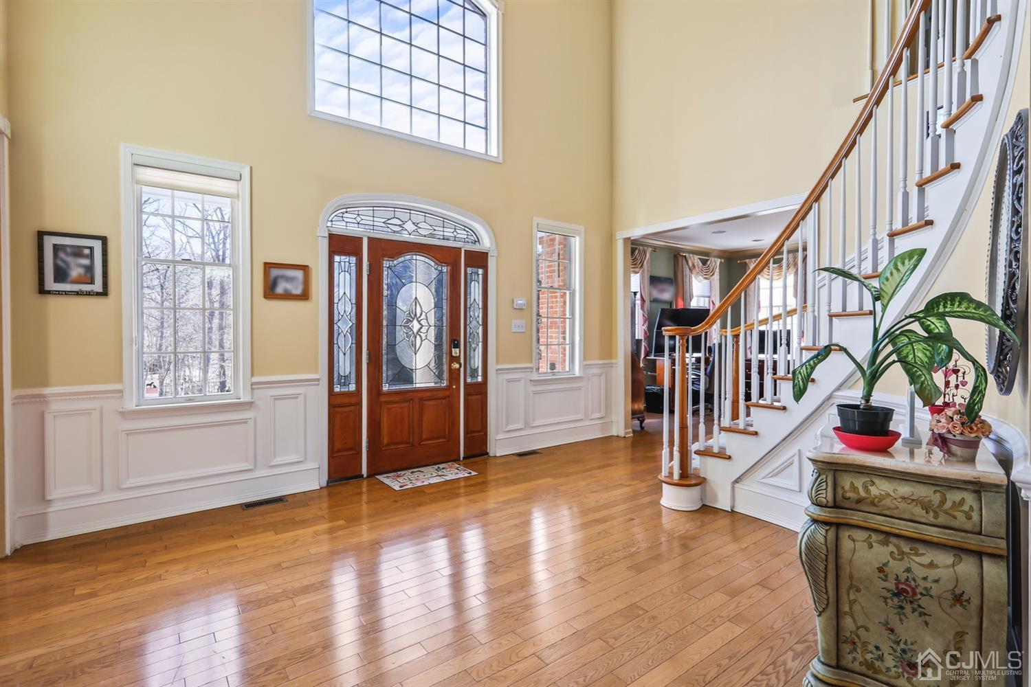102 Bennett Road Old Bridge, NJ 07747 - Photo 2 of 33 a view of an entryway with wooden floor and windows