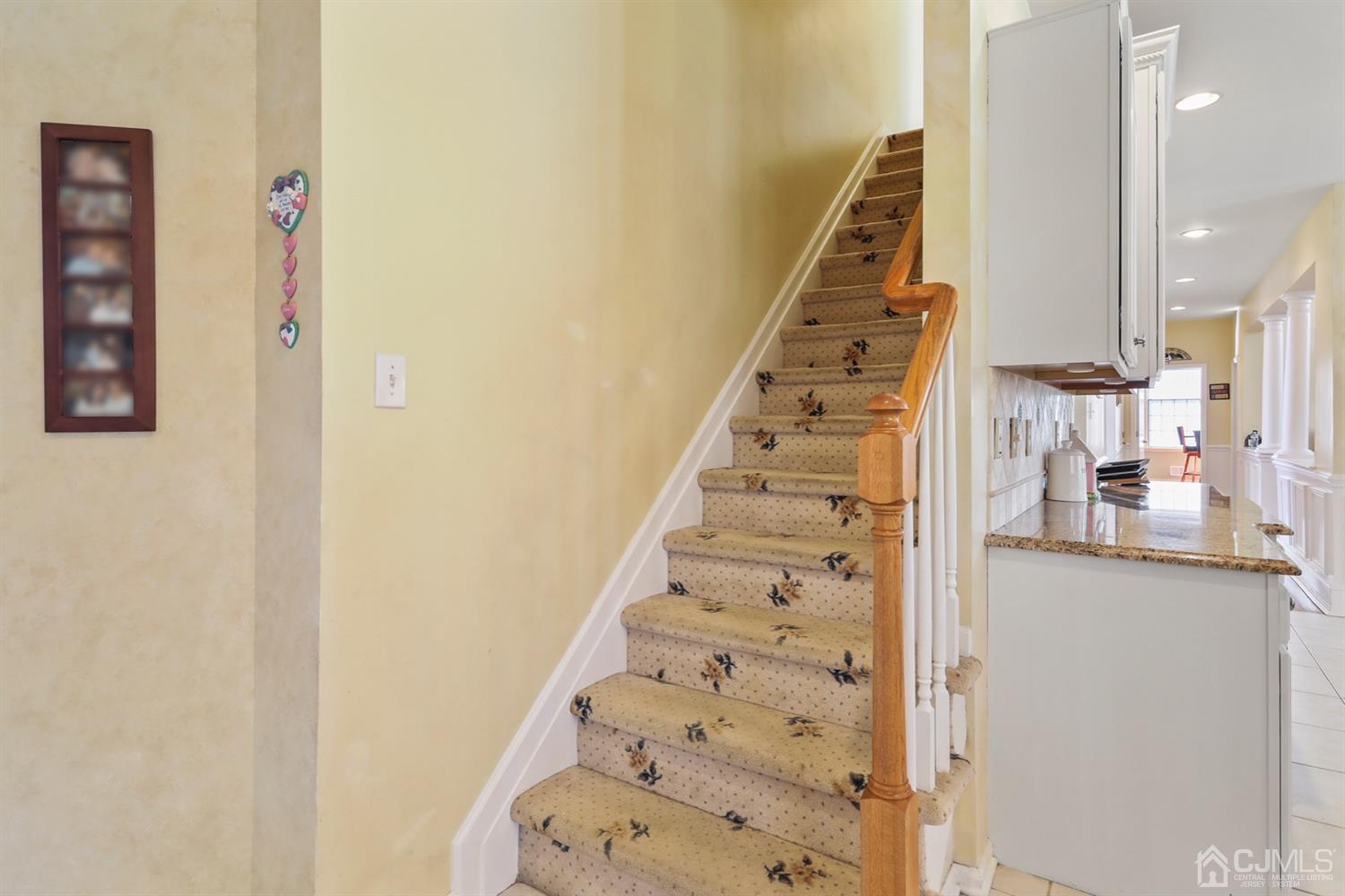 102 Bennett Road Old Bridge, NJ 07747 - Photo 22 of 33 a view of a hallway with wooden floor and entryway