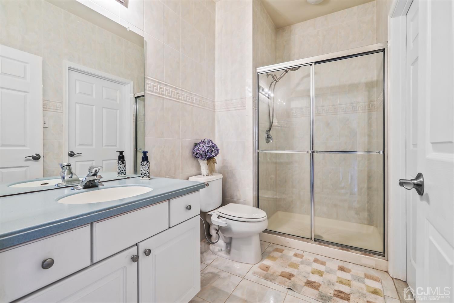 102 Bennett Road Old Bridge, NJ 07747 - Photo 25 of 33 a bathroom with a sink toilet and shower
