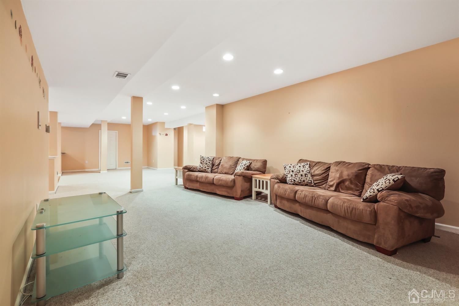 102 Bennett Road Old Bridge, NJ 07747 - Photo 29 of 33 a living room with furniture and a couch