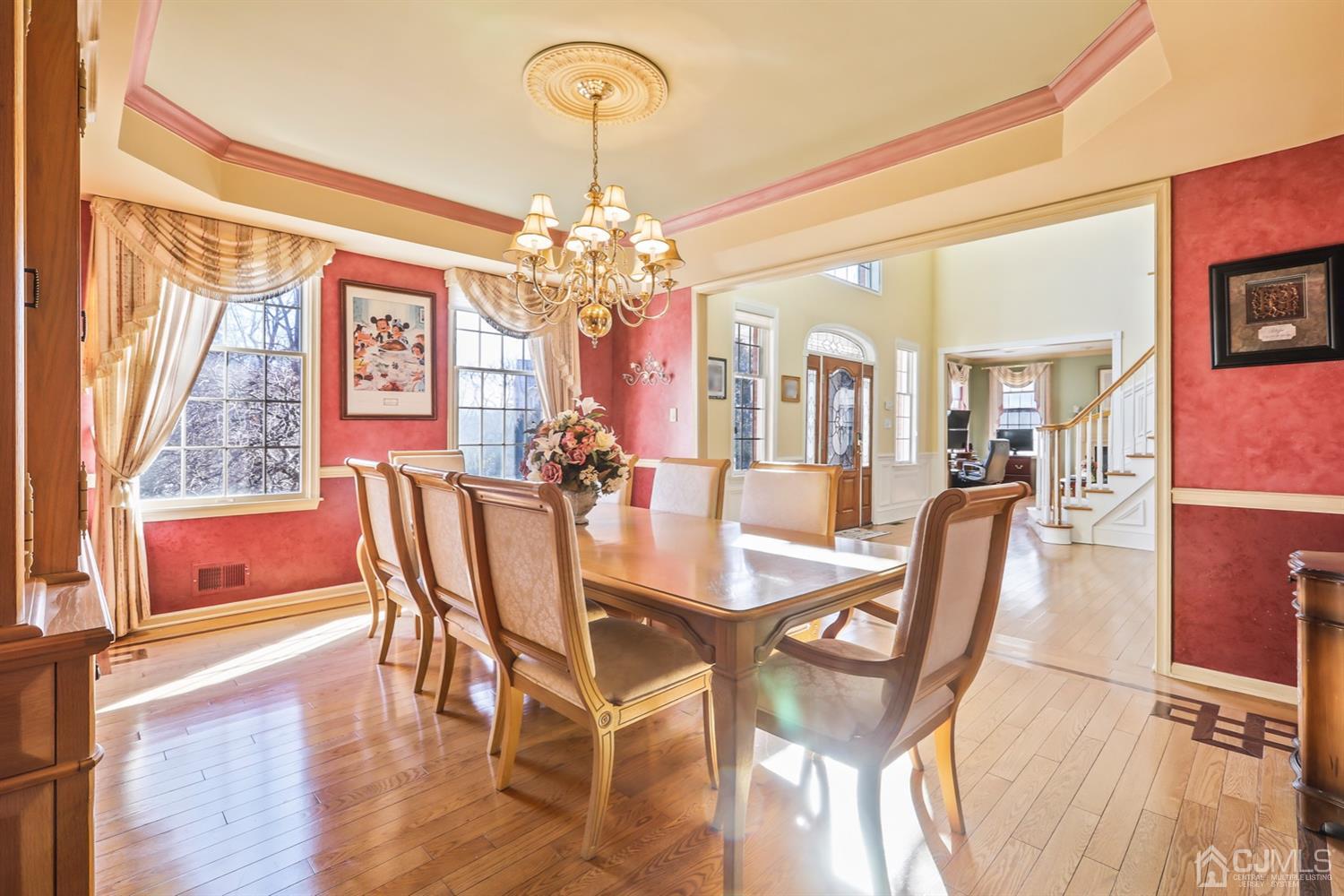 102 Bennett Road Old Bridge, NJ 07747 - Photo 5 of 33 a view of a dining room with furniture a chandelier and wooden floor