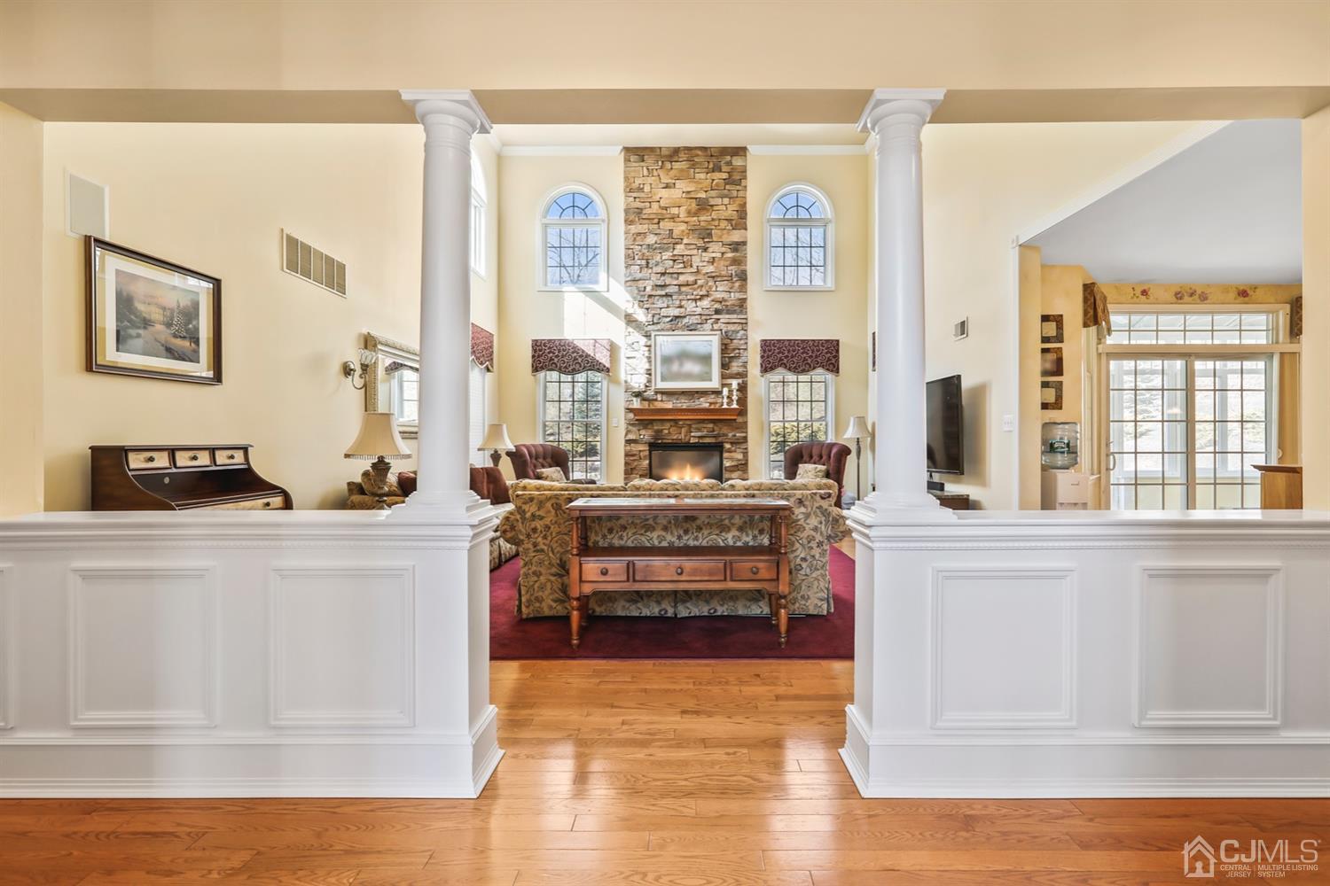 102 Bennett Road Old Bridge, NJ 07747 - Photo 7 of 33 a living room with furniture and large windows