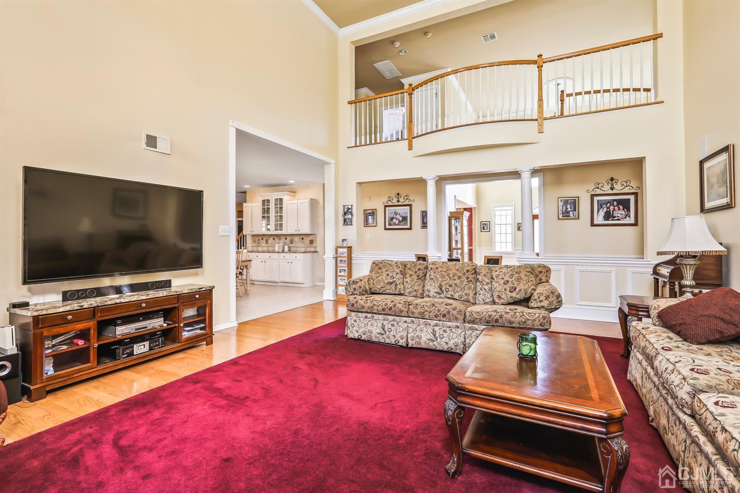 102 Bennett Road Old Bridge, NJ 07747 - Photo 8 of 33 a living room with furniture and a flat screen tv