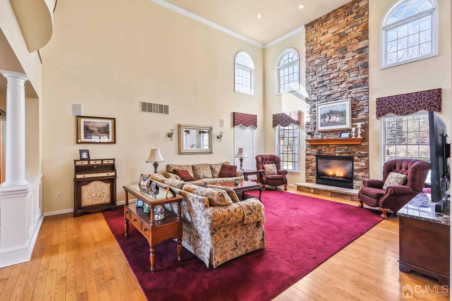 102 Bennett Road Old Bridge, NJ 07747 - Photo 9 of 33 a living room with furniture and a fireplace