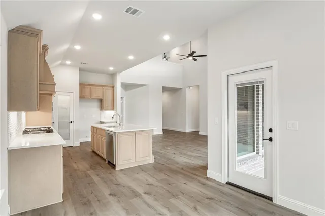 a kitchen with a stove and a sink