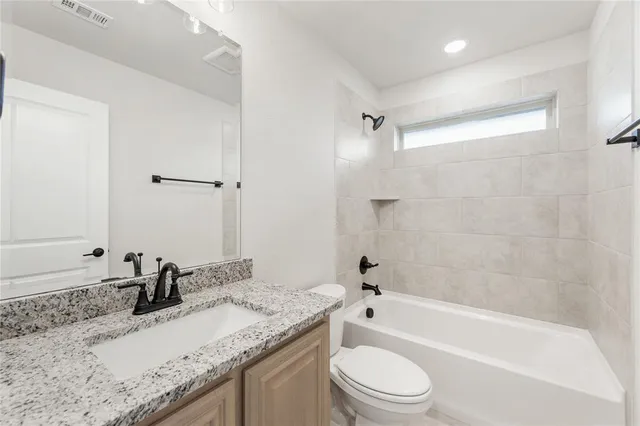 a bedroom with two beds and a large window