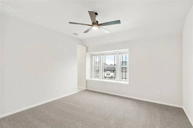 a view of a brick house with a large window