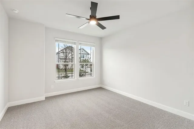a bathroom with a granite countertop tub sink toilet and mirror