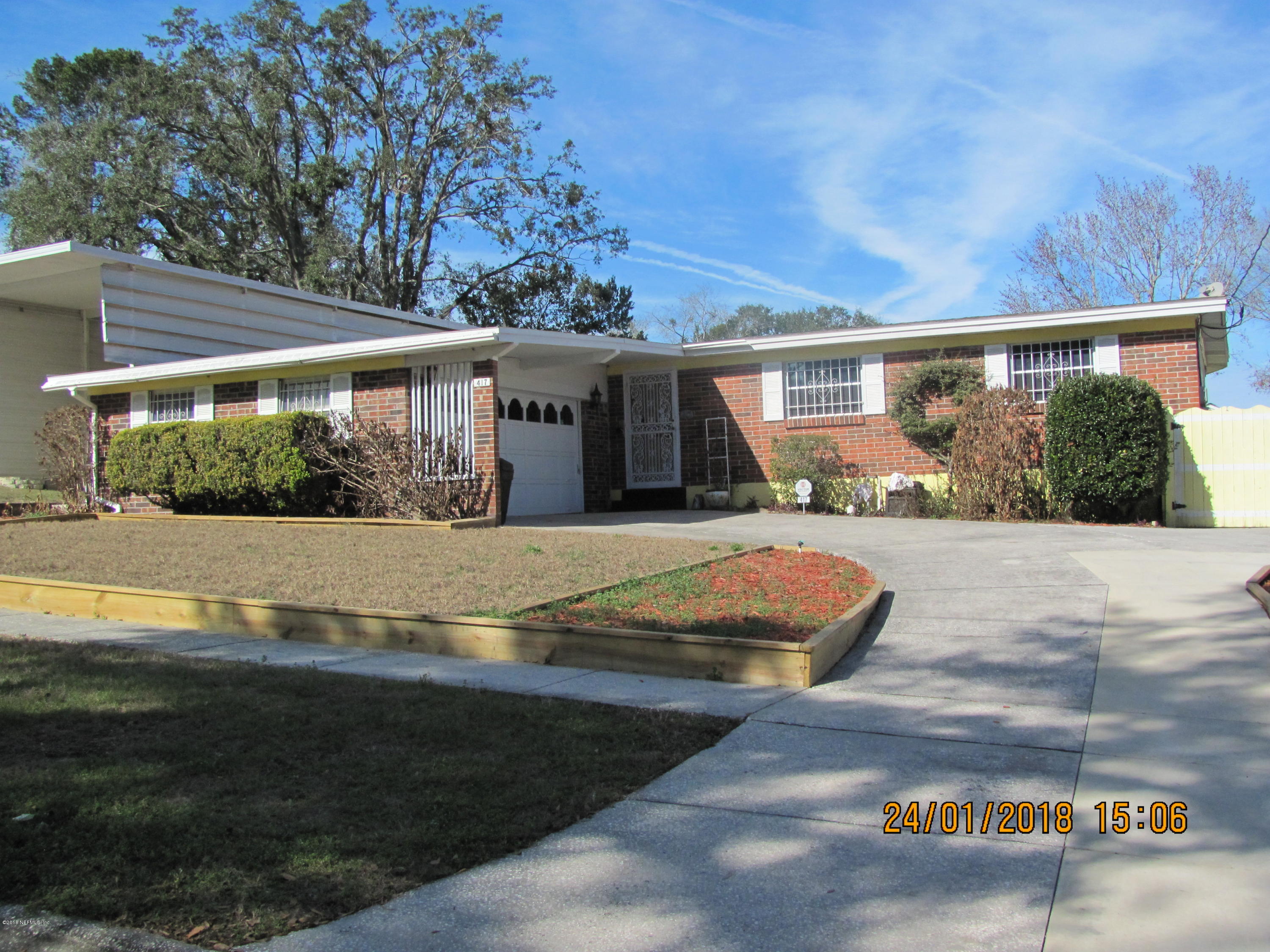 417 Sigsbee Road Orange Park, FL 32073 - Photo 1 of 21 a front view of house with yard