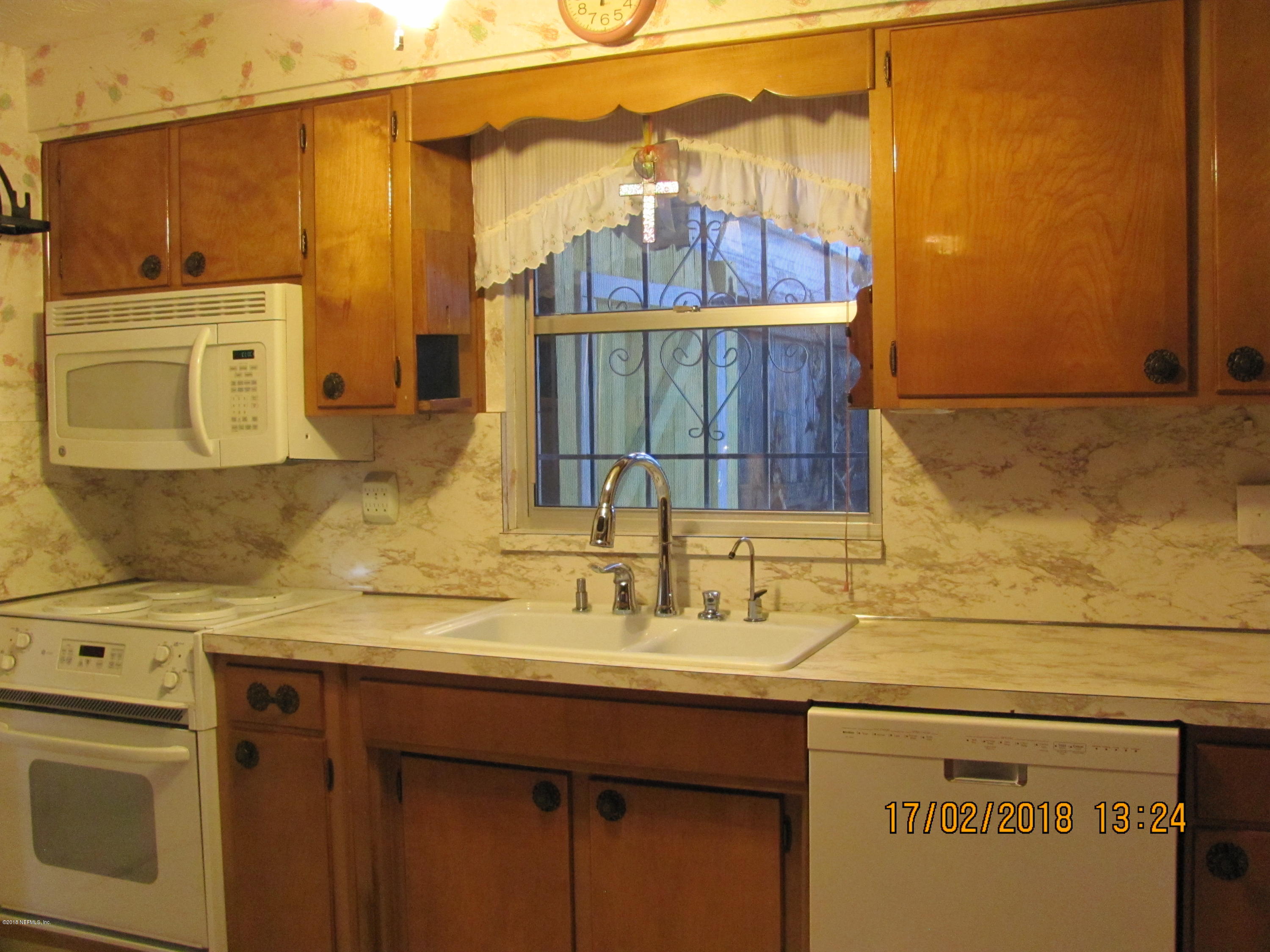 417 Sigsbee Road Orange Park, FL 32073 - Photo 16 of 21 a bathroom with a sink and a mirror