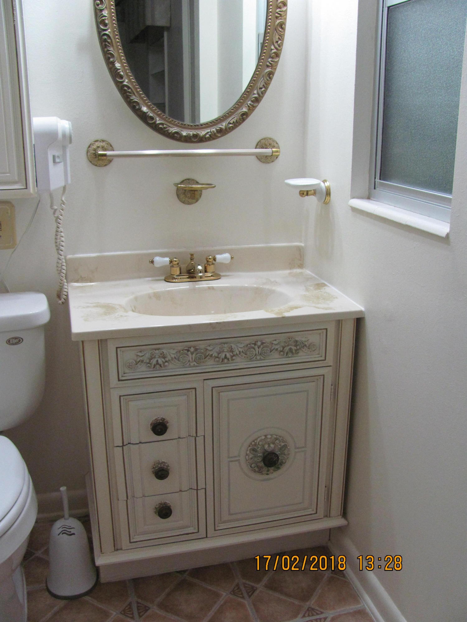 417 Sigsbee Road Orange Park, FL 32073 - Photo 17 of 21 a bathroom with a granite countertop sink a mirror and toilet
