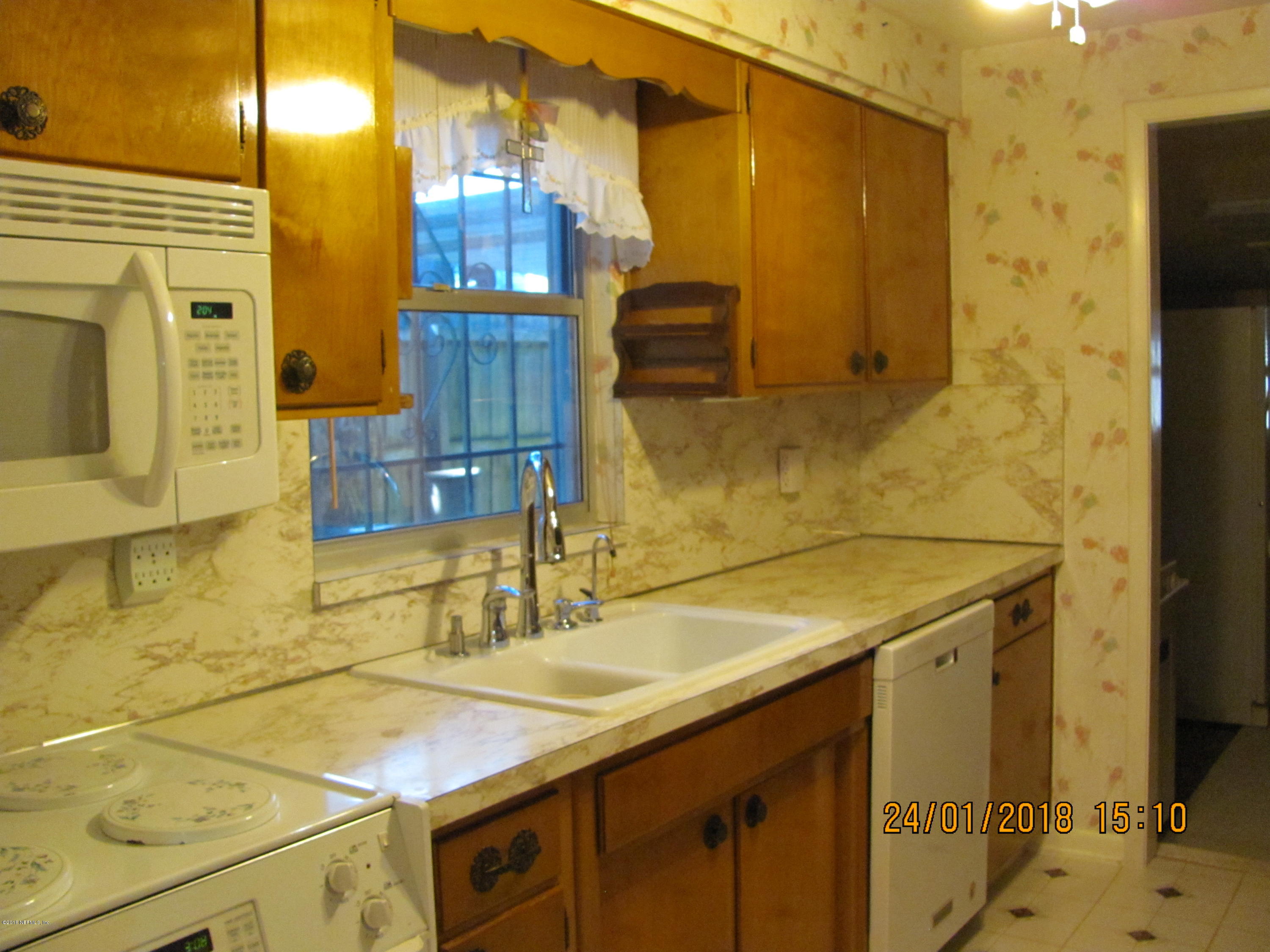 417 Sigsbee Road Orange Park, FL 32073 - Photo 2 of 21 a bathroom with a sink and a mirror