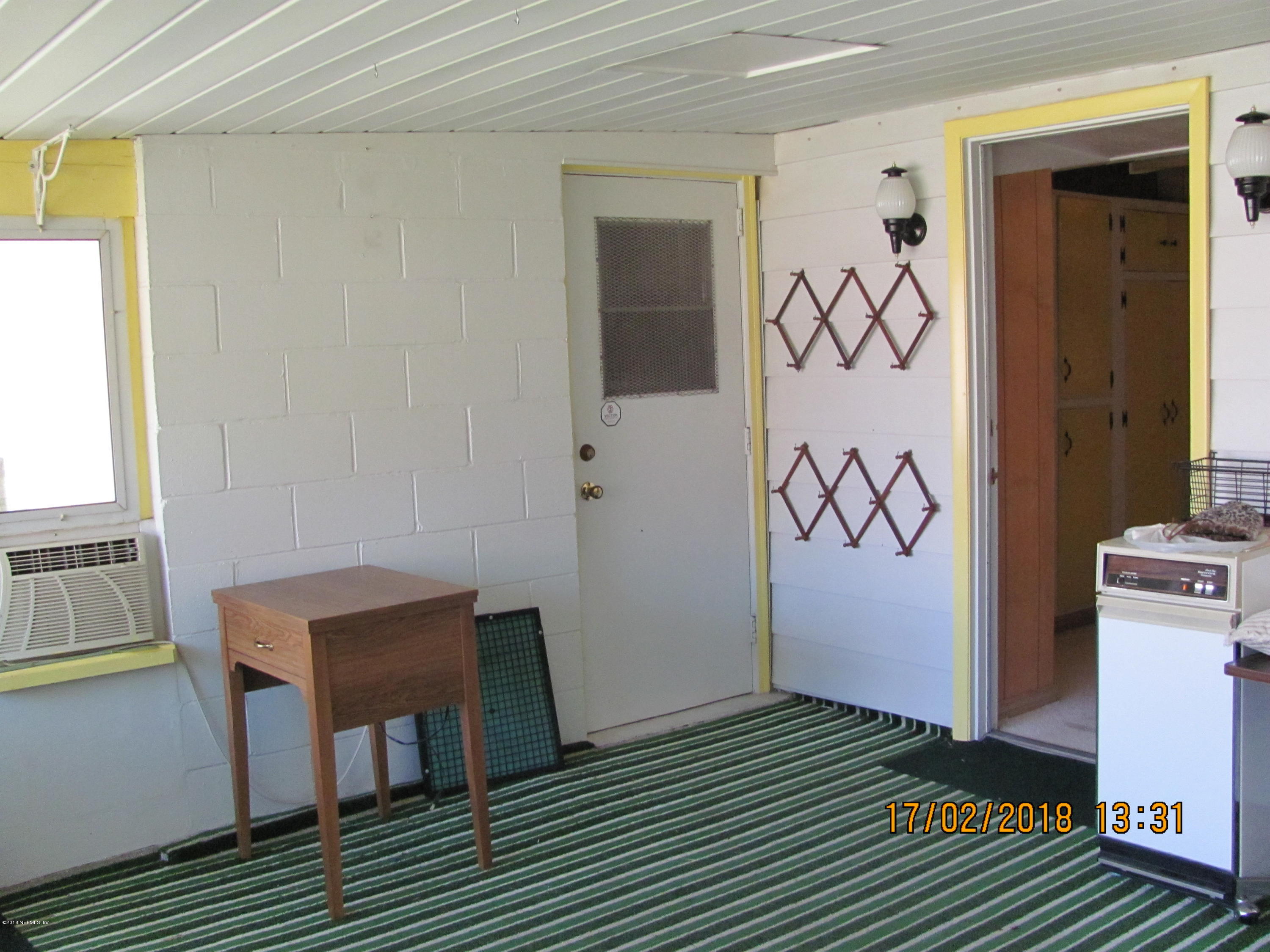 417 Sigsbee Road Orange Park, FL 32073 - Photo 21 of 21 a view of a room with wooden floor and cabinet
