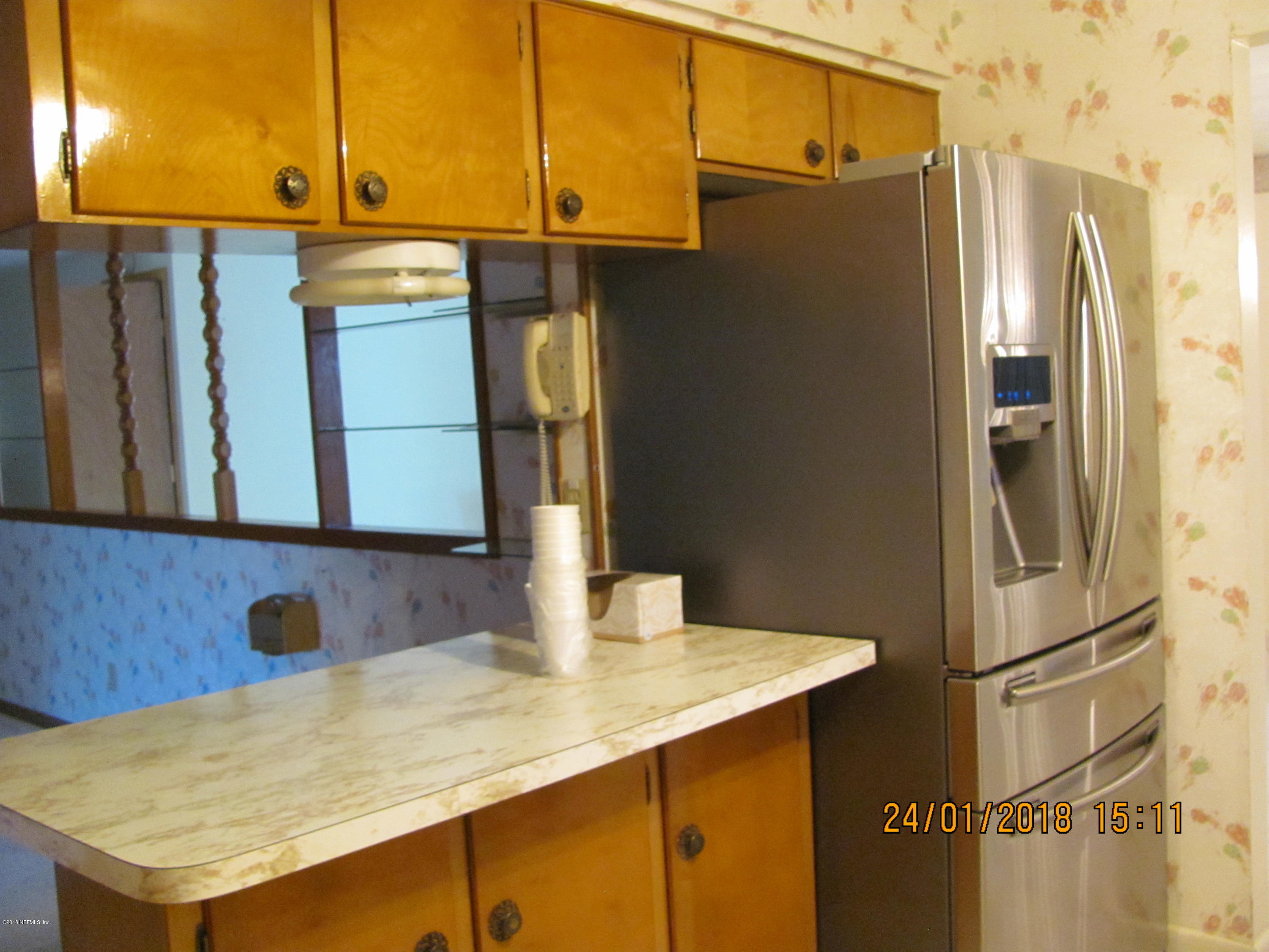 417 Sigsbee Road Orange Park, FL 32073 - Photo 4 of 21 a kitchen with stainless steel appliances a refrigerator and microwave
