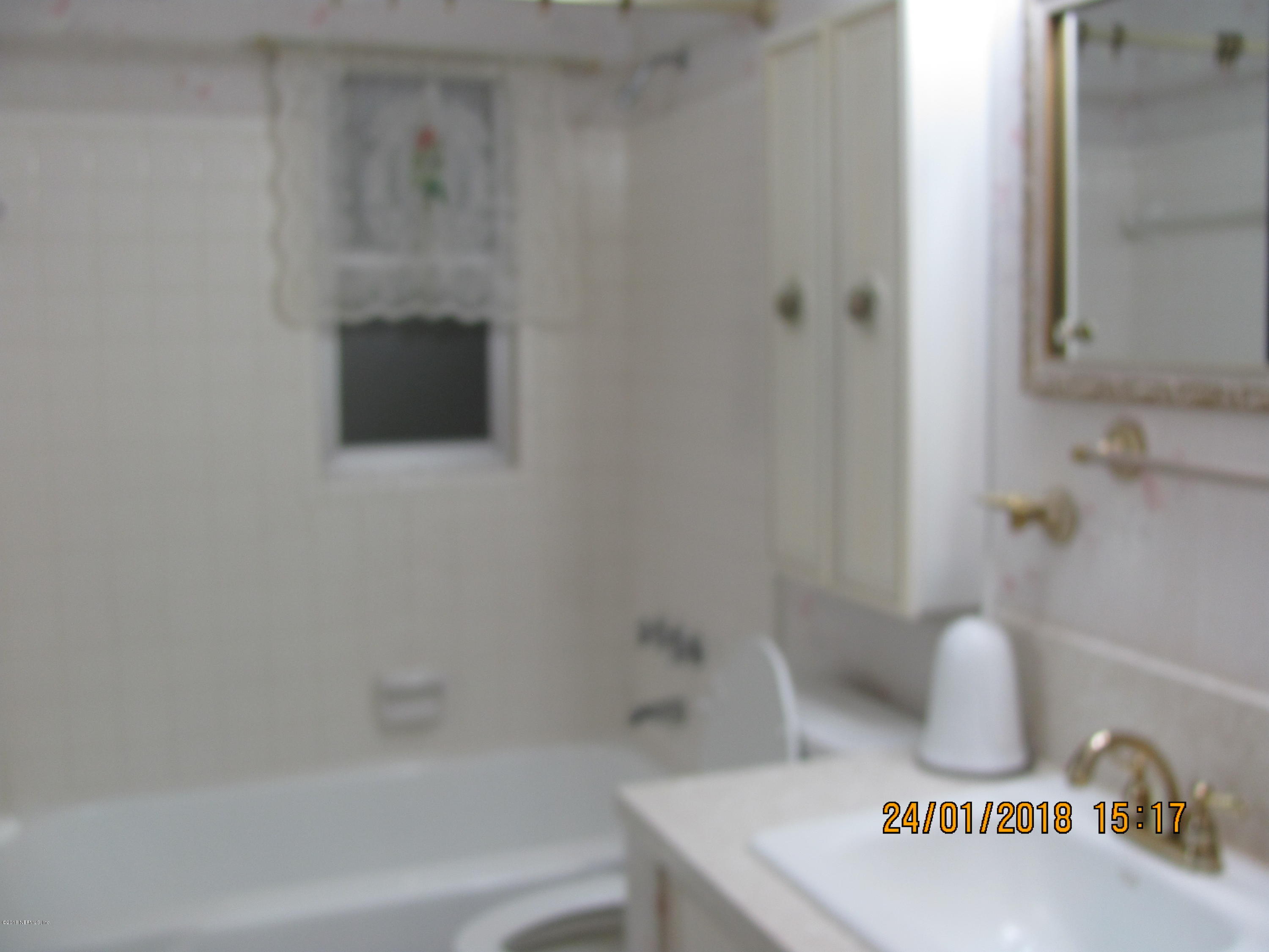 417 Sigsbee Road Orange Park, FL 32073 - Photo 10 of 21 a bathroom with a bathtub