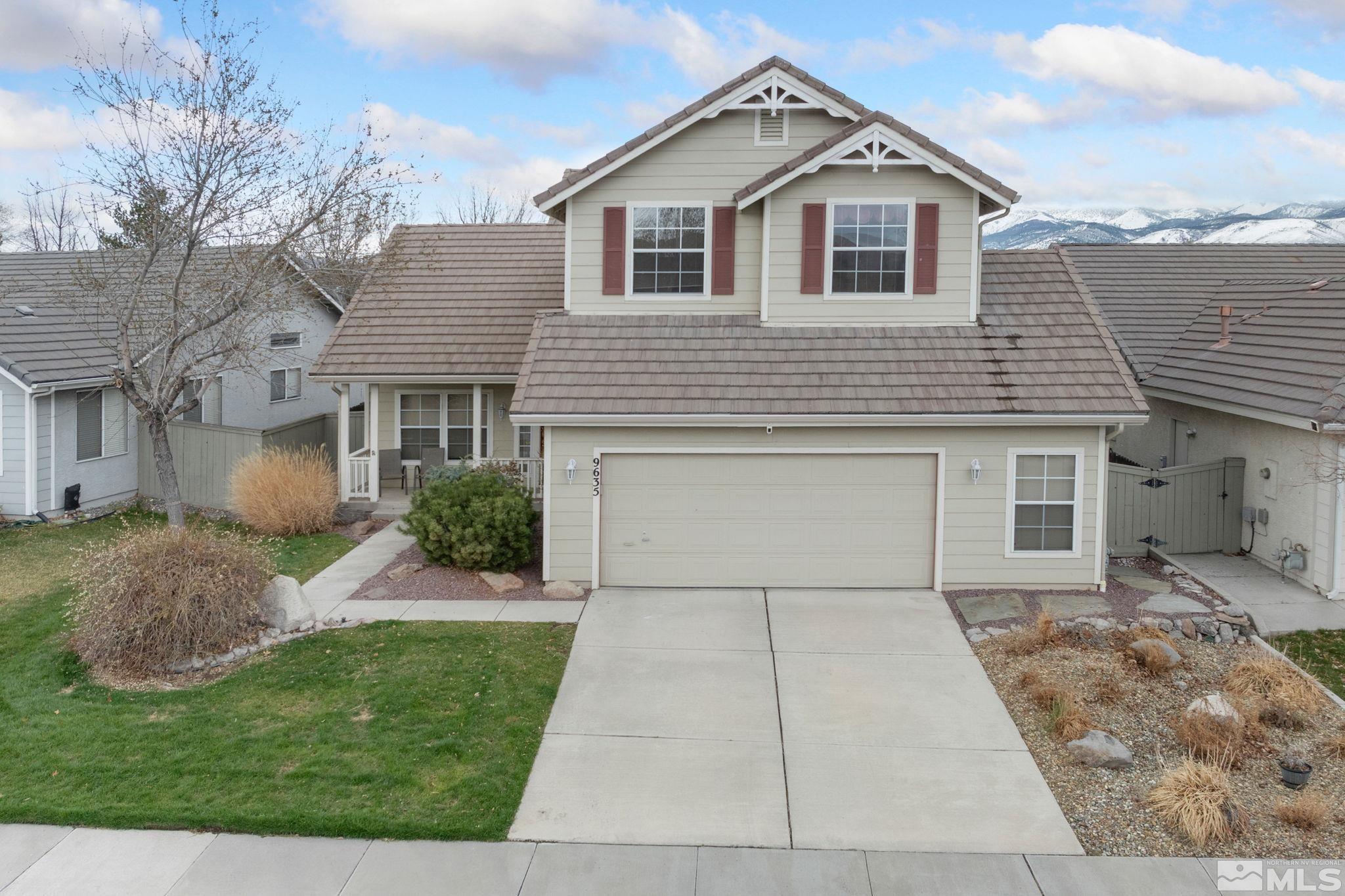 9635 Oakley Lane Reno, NV 89521 - Photo 2 of 40 a front view of a house with a yard and garage