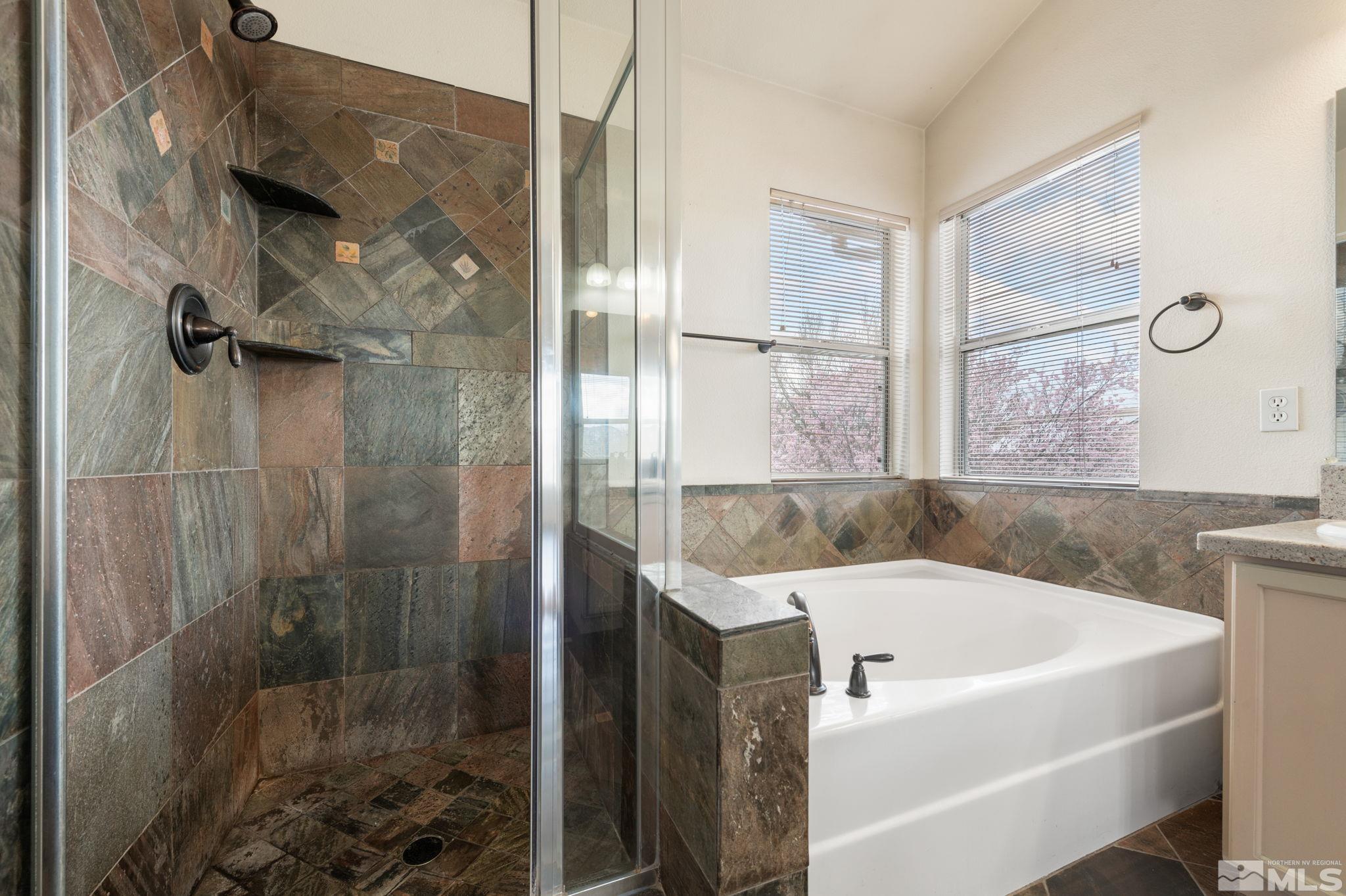 9635 Oakley Lane Reno, NV 89521 - Photo 24 of 40 a white bath tub sitting next to a shower