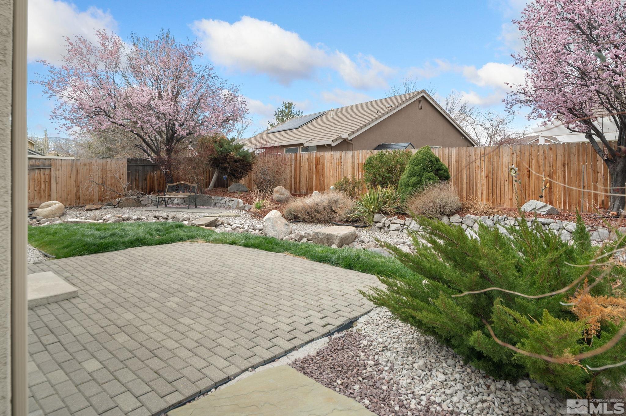 9635 Oakley Lane Reno, NV 89521 - Photo 35 of 40 a backyard of a house with lots of green space
