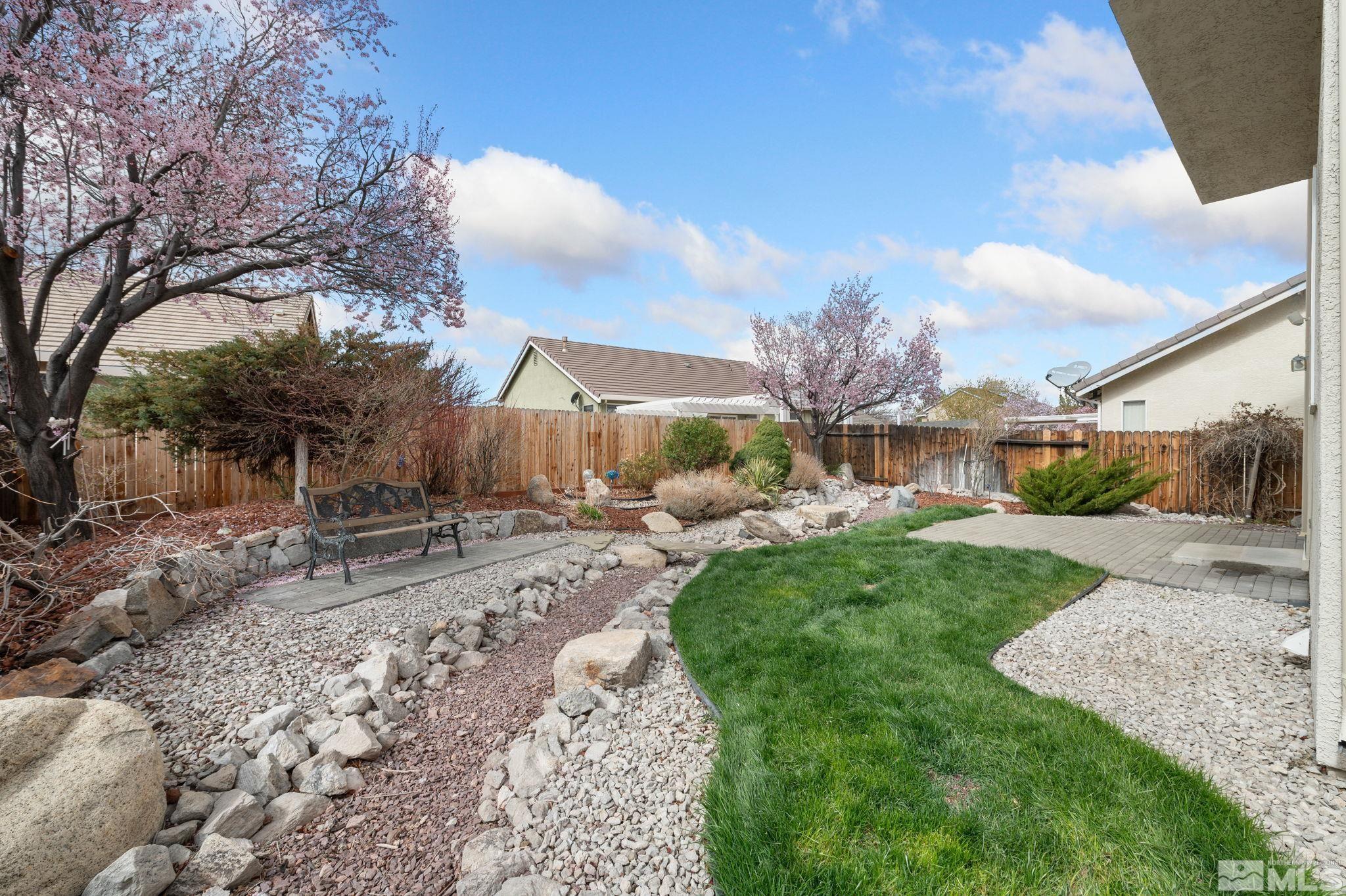 9635 Oakley Lane Reno, NV 89521 - Photo 36 of 40 a view of a garden with a bench