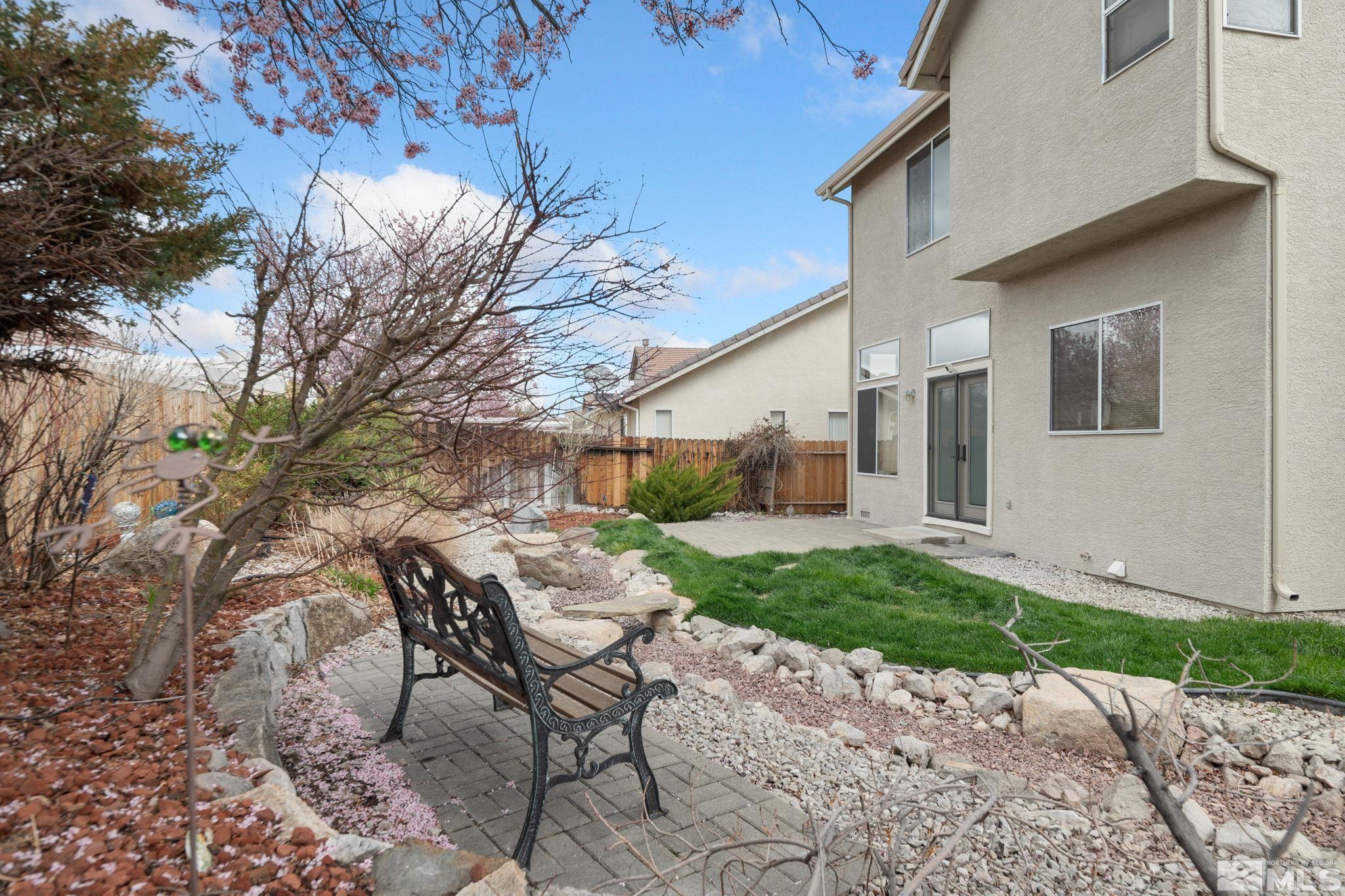 9635 Oakley Lane Reno, NV 89521 - Photo 37 of 40 a view of a patio with table and chairs and potted plants