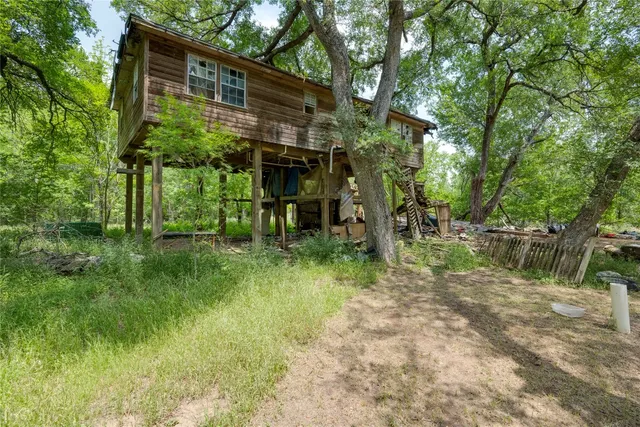 a backyard of a house with lots of green space
