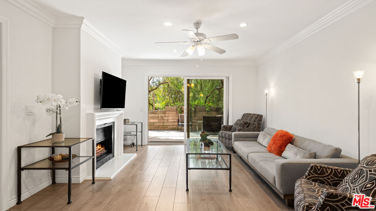 6487 Kanan Dume Road Malibu, CA 90265 - Photo 1 of 2 a living room with furniture and a flat screen tv