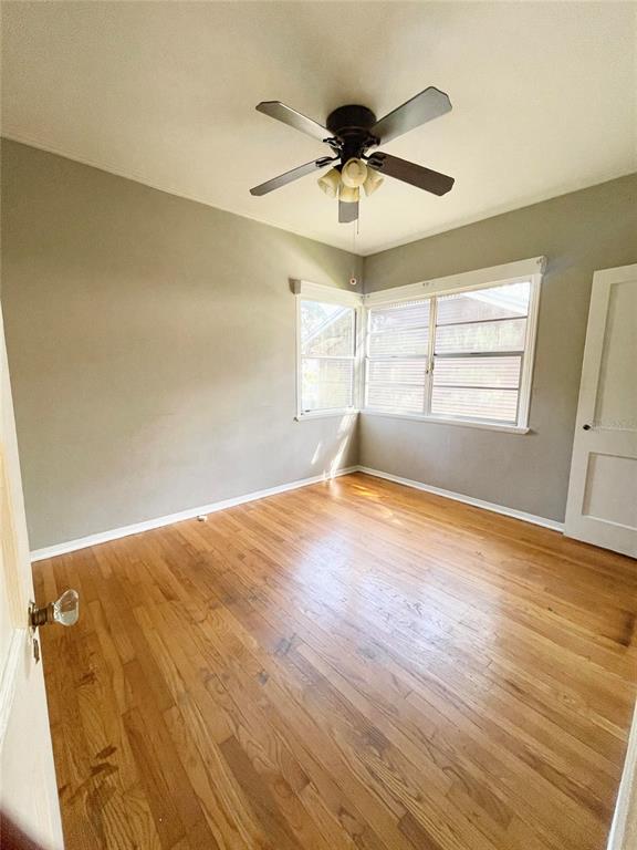 915 East Walnut Street Lakeland, FL 33801 - Photo 20 of 27 a view of empty room with wooden floor and fan