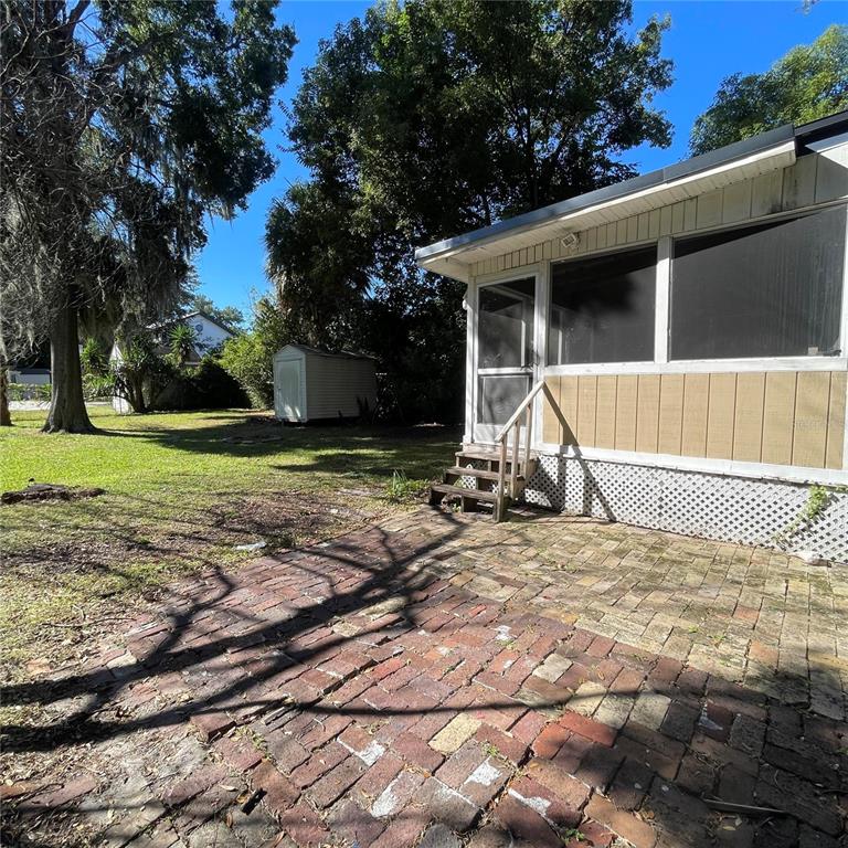 915 East Walnut Street Lakeland, FL 33801 - Photo 26 of 27 a view of a house with a yard and tree