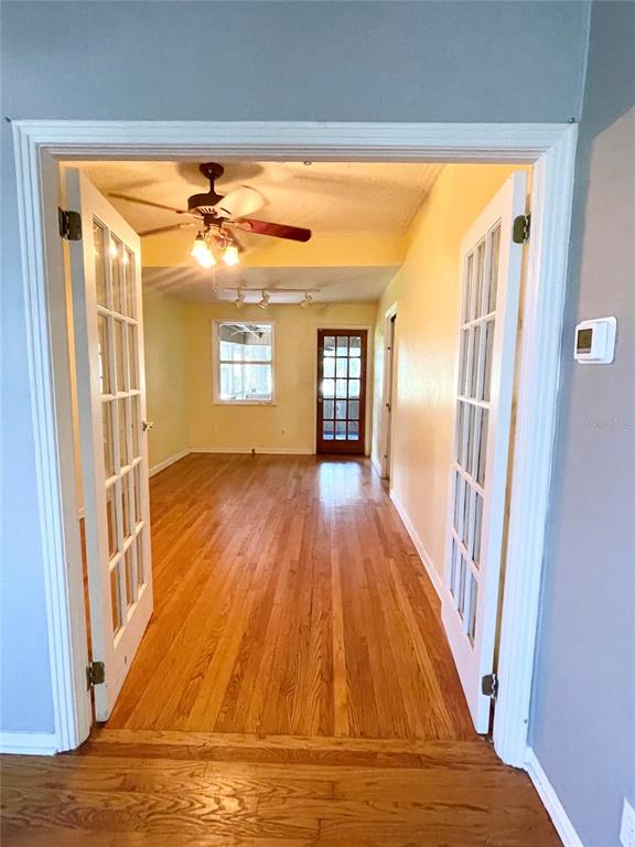 915 East Walnut Street Lakeland, FL 33801 - Photo 9 of 27 a view of a room with wooden floor and a fireplace