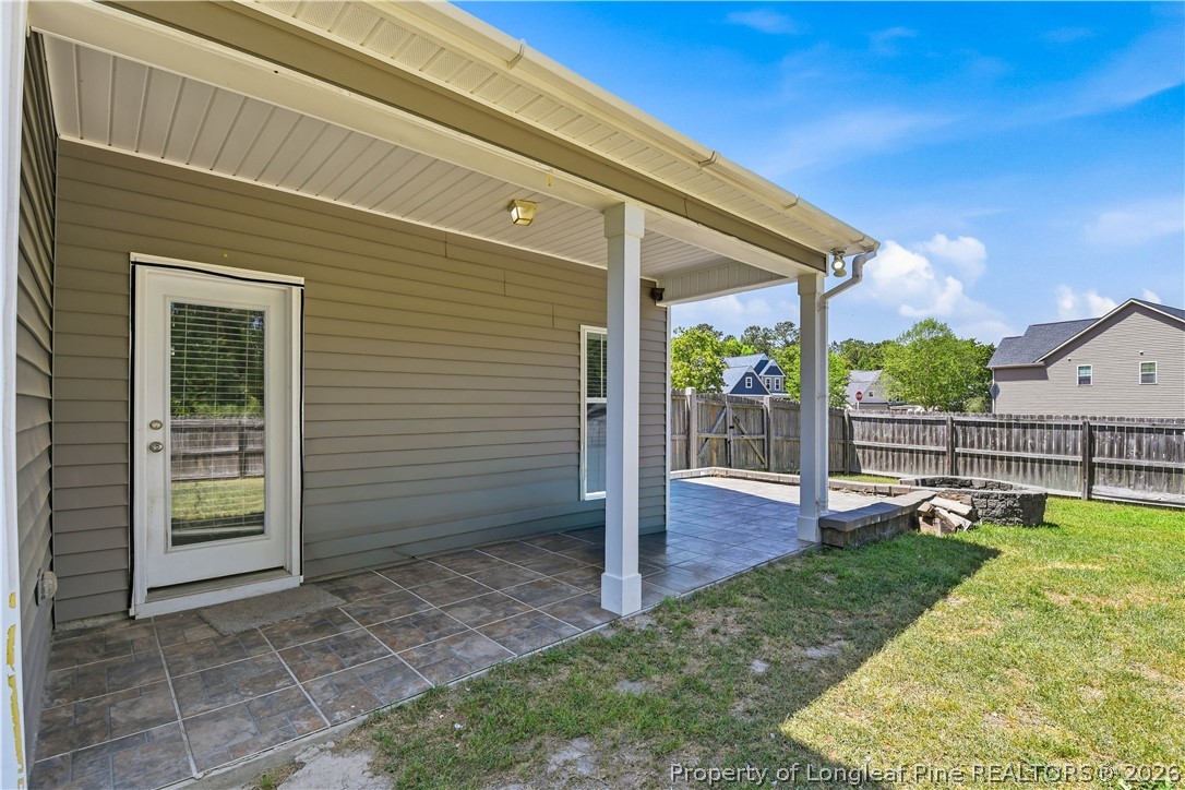 140 Birch Avenue Spring Lake, NC 28390 - Photo 10 of 49 a view of a house with backyard and porch