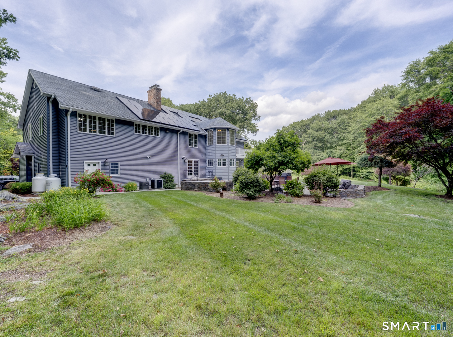 13 Executive Hill Road Wolcott, CT 06716 - Photo 30 of 40 a front view of a house with a garden