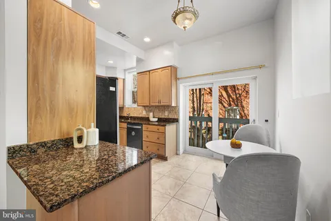 a kitchen with stainless steel appliances a refrigerator and a counter