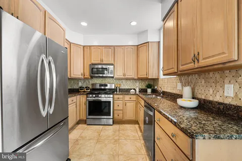 a bedroom with a bed couch and window