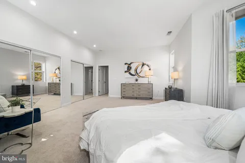 a white bath tub sitting next to a toilet