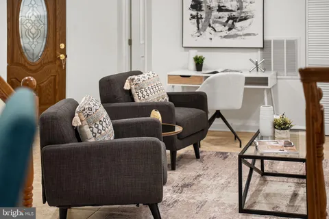 a view of a livingroom with furniture and chandelier