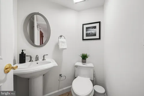 a kitchen with stainless steel appliances granite countertop a stove a sink a microwave a dining table and chairs